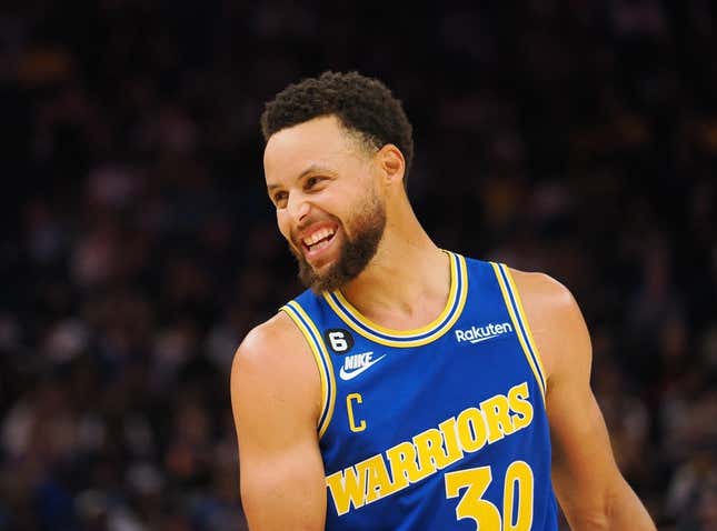 Nov 14, 2022; San Francisco, California, USA; Golden State Warriors point guard Stephen Curry (30) smiles between plays against the San Antonio Spurs during the second quarter at Chase Center.