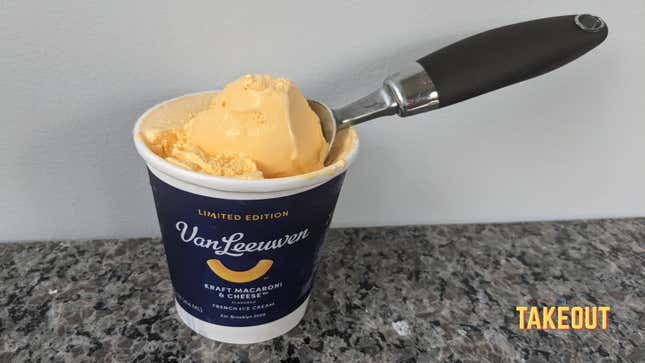 Pint of Van Leeuwen Kraft Macaroni & Cheese ice cream with scooper on countertop