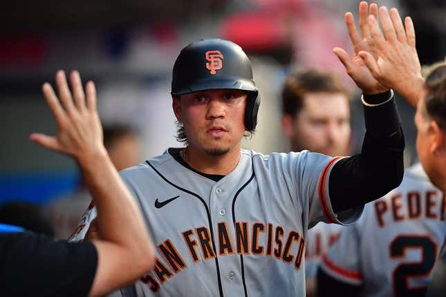 Aug 7, 2023; Anaheim, California, USA; San Francisco Giants first baseman Wilmer Flores (41) is greeted after scoring a run against the Los Angeles Angels during the fourth inning at Angel Stadium.