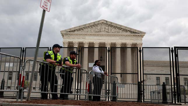 U.S. Capitol Police officers observe an abortion rights rally in front of the U.S. Supreme Court building on May 05, 2022 in Washington, DC. Protestors on both sides of the abortion debate continue to demonstrate following the leaked draft of the Court's potential decision to overturn Roe v. Wade.