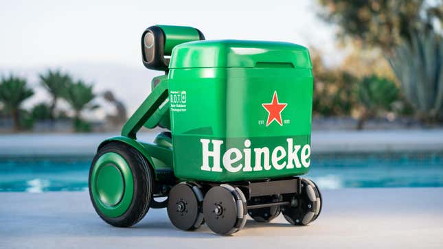 Green Heineken beer cooler robot in front of an in-ground pool