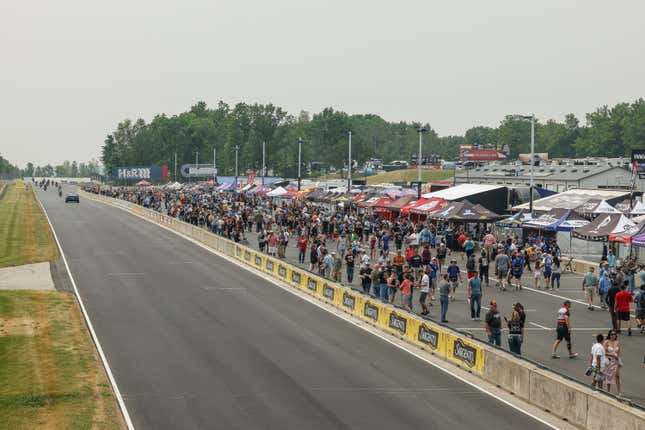 Bird’s-eye view of fans crowding the pits along the front straight at Road America in June, waiting for the first lap of the race.