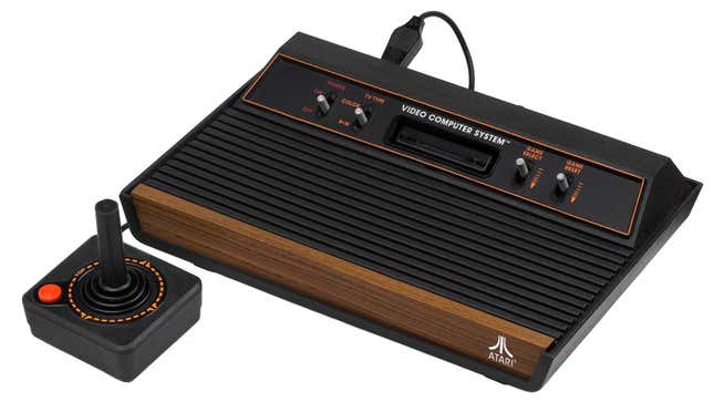 An Atari 2600 console is seen with its controller.