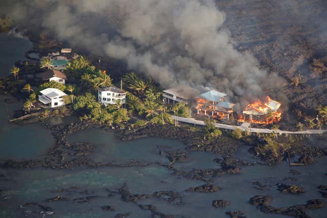 Image for article titled New aerial photos show Kilauea’s lava devouring neighborhoods