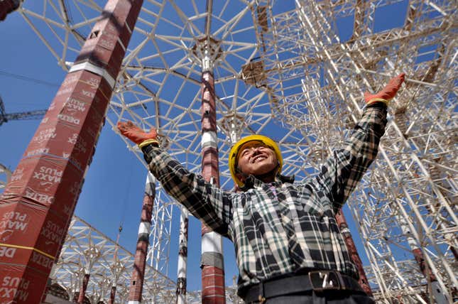 A worker is pictured in the Grand Mosque of Algiers under construction in the Algerian capital on April 23, 2016. Algeria is building one of the worlds largest mosques with a 265m-high minaret (874 feet) the worlds tallest as well as a 20,000 square meters prayer hall capable of accommodating up to 120,000 worshippers.