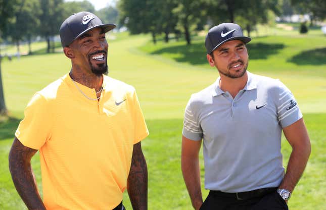 J.R. Smith of the Cleveland Cavaliers and Jason Day of Australia speak on the 18th green during a preview day of the World Golf Championships - Bridgestone Invitational at Firestone Country Club South Course on August 2, 2017 in Akron, Ohio.