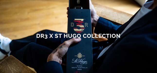 Daniel Ricciardo is shown in a close-up photo opening a bottle of his DR3 wine.