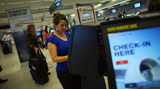 Evelyn Rebuli checks in for her flight to Orlando on American Airlines in the Miami International Airport on September 18, 2012 in Miami, Florida.