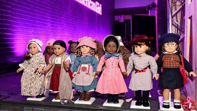Row of original American Girl dolls