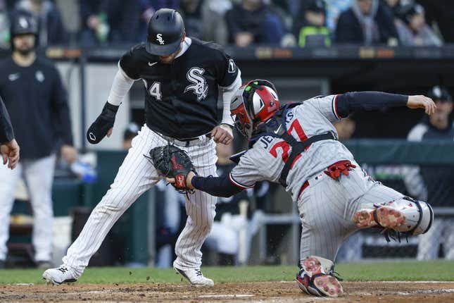 May 3, 2023; Chicago, Illinois, USA; Minnesota Twins catcher Ryan Jeffers (27) tags out Chicago White Sox catcher Yasmani Grandal (24) at home plate during the fourth inning at Guaranteed Rate Field.