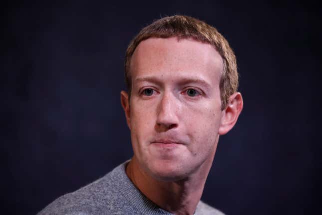 A portrait of Mark Zuckerberg in a gray sweater, his expression pinched.