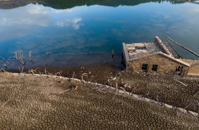 An old house, submerged three decades ago when a hydropower dam flooded the valley.