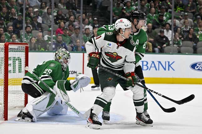 Apr 19, 2023; Dallas, Texas, USA; Dallas Stars goaltender Jake Oettinger (29) and defenseman Esa Lindell (23) and Minnesota Wild right wing Brandon Duhaime (21) in action during the game between the Dallas Stars and the Minnesota Wild in game two of the first round of the 2023 Stanley Cup Playoffs at American Airlines Center.