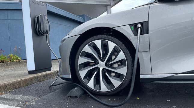A Lucid electric vehicle sits parked at a charging station outside of a Lucid Studio on March 29, 2023 in Corte Madera, California