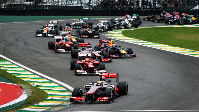 A photo of the 2012 Formula 1 grid racing in Brazil. 