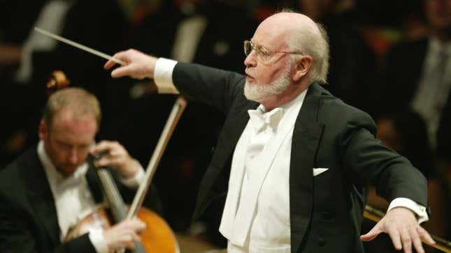 John Williams conducts an orchestra.