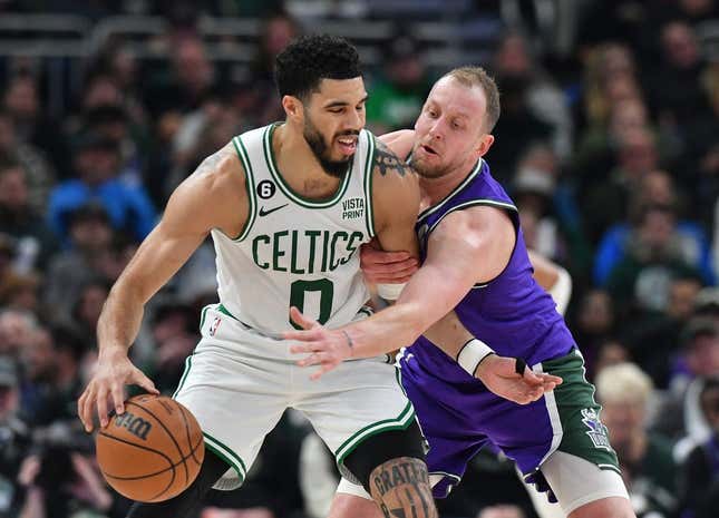 Mar 30, 2023; Milwaukee, Wisconsin, USA; Milwaukee Bucks guard Goran Dragic (7) reaches in on Milwaukee Bucks guard Boston Celtics forward Jayson Tatum (0) in the first half at Fiserv Forum.