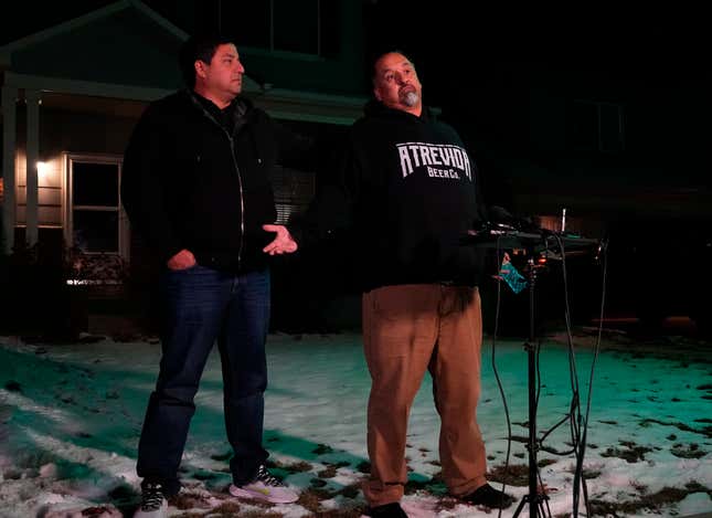 Richard Fierro, left, talks with his brother Ed Fierro standing with him for support at his home during a news conference about his efforts to subdue the gunman in the Club Q nightclub shooting Monday, Nov. 21, 2022, in Colorado Springs, Colo. 
