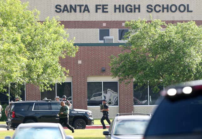 In this May 18, 2018, file photo, law enforcement officers respond to Santa Fe High School after an active shooter was reported on campus in Santa Fe, Texas.