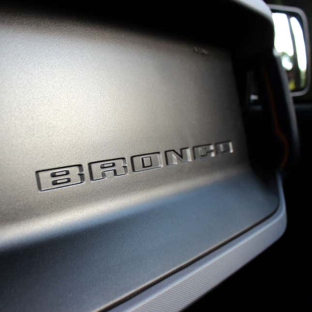 A photo of the Bronco logo on the car's dash. 