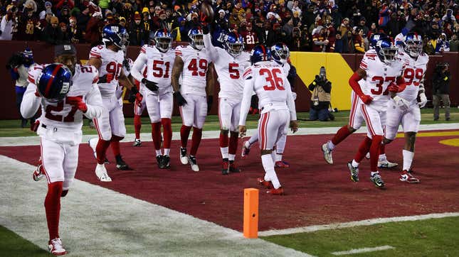 Giants rookie Kayvon Thibodeaux celebrates with teammates after scoring TD in Sunday night’s win over Commanders.