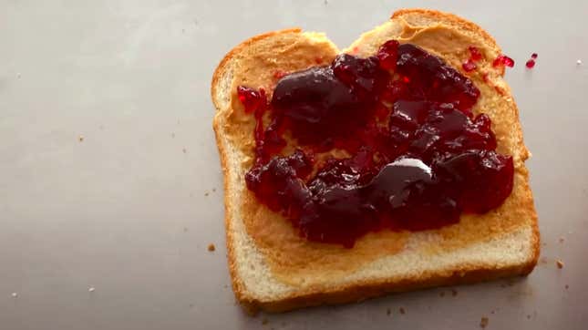 Single slice of bread with peanut butter and jelly