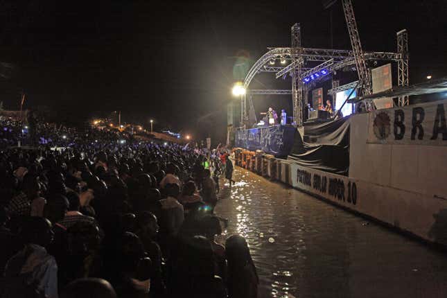 Malian singer Salif Keita, rear center, performs on stage in 2014 at Segou, Mali.