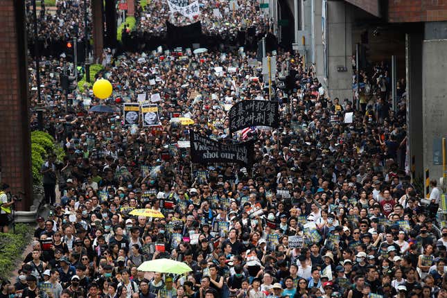 Protesters march through the Sha Tin District in Hong Kong, July 14, 2019.