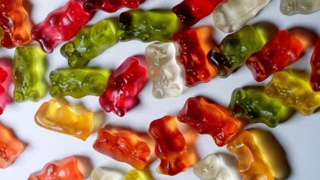 Multicolored gummy bears on white background