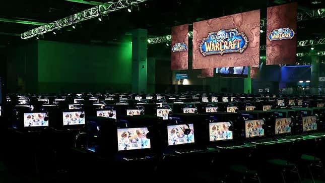 Rows and rows of gaming laptops sit unattended at a BlizzCon World of Warcraft event. 