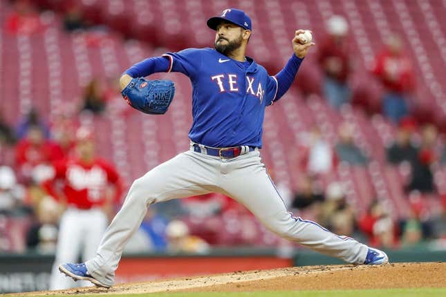 Apr 25, 2023; Cincinnati, Ohio, USA; Texas Rangers starting pitcher Martin Perez (54) pitches against the Cincinnati Reds in the first inning at Great American Ball Park.