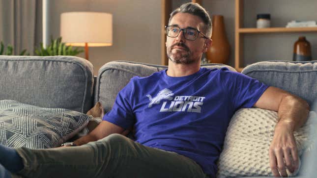 Image for article titled Lions Fan Praying Players Start Protesting Police Brutality Or Something So He Can Stop Watching