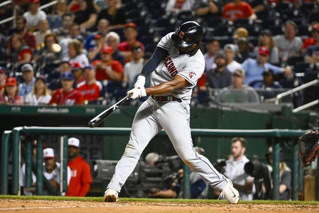 Apr 15, 2023; Washington, District of Columbia, USA; Cleveland Guardians first baseman Josh Bell (55) hits an RBI double against the Washington Nationals during the ninth inning at Nationals Park.