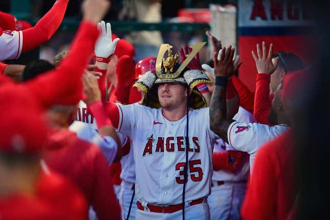 Apr 21, 2023; Anaheim, California, USA; Los Angeles Angels catcher Chad Wallach (35) is greeted after hitting a two run home run against the Kansas City Royals during the third inning at Angel Stadium.
