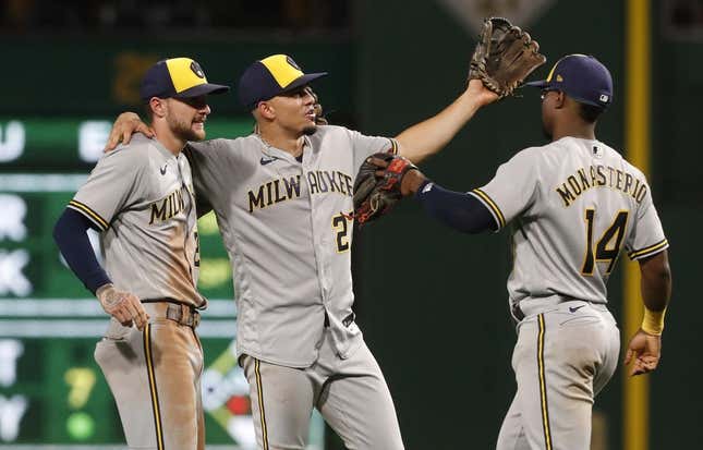 Sep 5, 2023; Pittsburgh, Pennsylvania, USA; Milwaukee Brewers second baseman Brice Turang (2) and shortstop Willy Adames (27) and third baseman Andruw Monasterio (14) celebrate after defeating the Pittsburgh Pirates at PNC Park. The Brewers won 7-3.