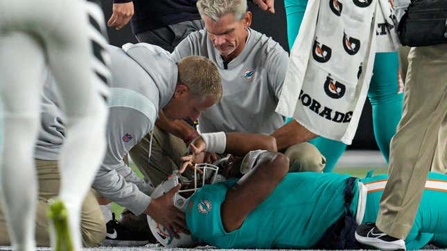 Miami Dolphins quarterback Tua Tagovailoa is examined during the first half of the team’s NFL football game against the Cincinnati Bengals, Thursday, Sept. 29, 2022, in Cincinnati.