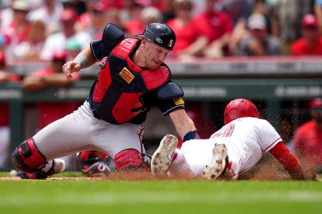 Jun 25, 2023; Cincinnati, Ohio, USA; Atlanta Braves catcher Sean Murphy (12) tags out Cincinnati Reds center fielder TJ Friedl (29) at home plate in the first inning of a baseball game at Great American Ball Park.