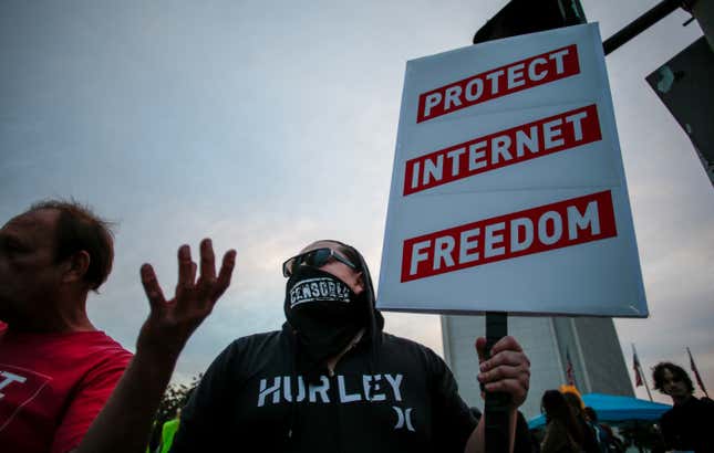 Net Neutrality advocates protest the FCC's recent decision to repeal the program in Los Angeles, California, November 28, 2017.