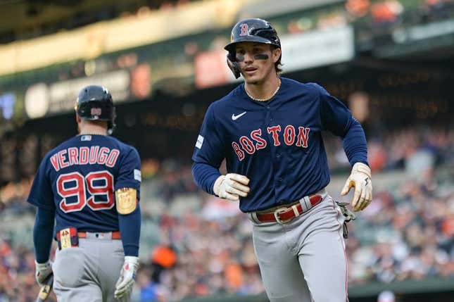 Apr 25, 2023; Baltimore, Maryland, USA; Boston Red Sox center fielder Jarren Duran (16) runs to the dugout after scoring during the second inning against the Baltimore Orioles  at Oriole Park at Camden Yards.
