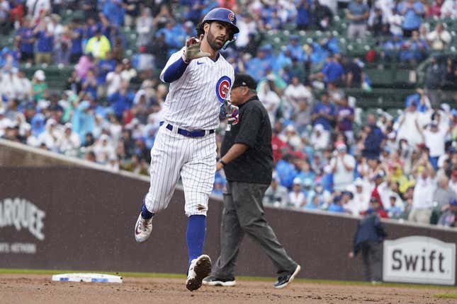 Aug 5, 2023; Chicago, Illinois, USA; Chicago Cubs shortstop Dansby Swanson (7) gestures after hitting a two-run home run against the Atlanta Braves during the first inning at Wrigley Field.