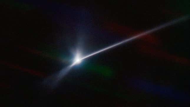 A bright ray of light shows the debris trail caused by NASA's DART test.