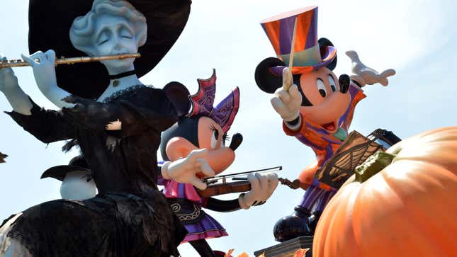 A statue of Minnie Mouse and Mickey Mouse are part of the Halloween festivities.