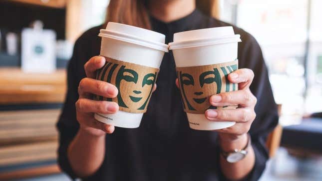 Two Starbucks cups held side by side