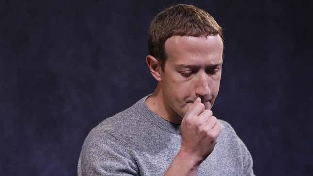 Mark Zuckerberg looking pensive against a blue background.
