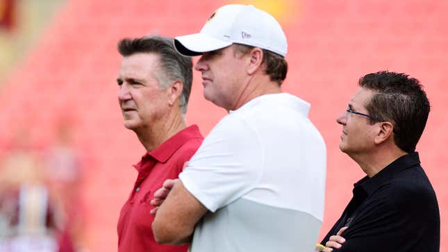Washington Redskins team president Bruce Allen, head coach Jay Gruden and owner Dan Snyder look on during warm ups before a preseason game against the Cincinnati Bengals