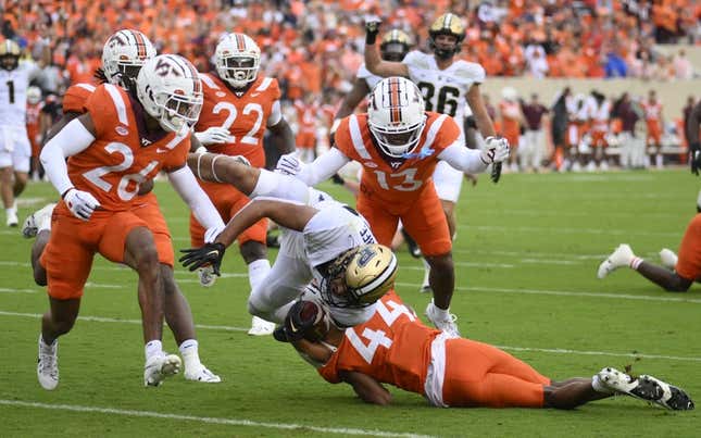 Sep 9, 2023; Blacksburg, Virginia, USA; Virginia Tech Hokies cornerback Dorian Strong (44) attempts to tackle Purdue Boilermakers running back Devin Mockobee (45) but he could not stop the dive into the end zone in the first quarter at Lane Stadium.