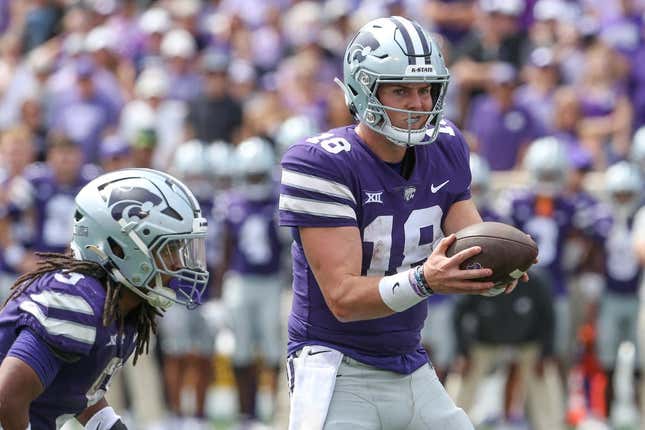 Sep 9, 2023; Manhattan, Kansas, USA; Kansas State Wildcats quarterback Will Howard (18) fakes a handoff to wide receiver RJ Garcia II (3) during the fourth quarter against the Troy Trojans at Bill Snyder Family Football Stadium.