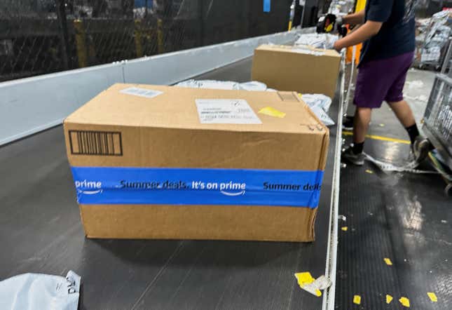 A conveyor belt full of Amazon packages