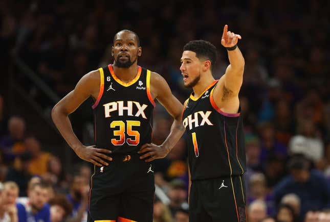 Apr 18, 2023; Phoenix, Arizona, USA; Phoenix Suns guard Devin Booker (1) with forward Kevin Durant (35) against the Los Angeles Clippers in the second half during game two of the 2023 NBA playoffs at Footprint Center.
