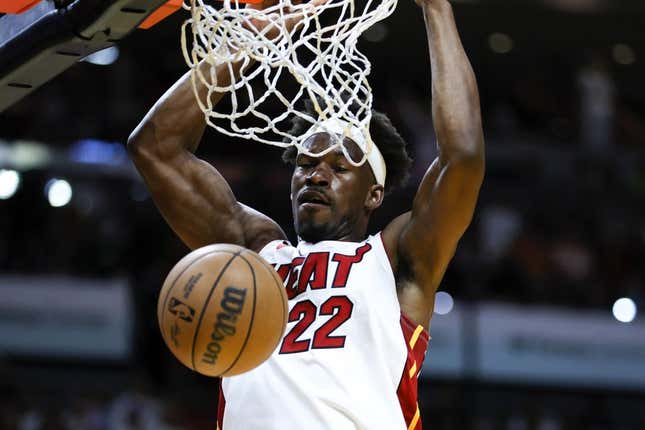 Apr 14, 2023; Miami, Florida, USA; Miami Heat forward Jimmy Butler (22) dunks the basketball during the first quarter against the Chicago Bulls at Kaseya Center.